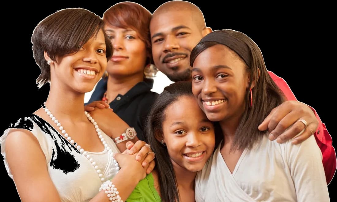 A smiling family of five standing close together